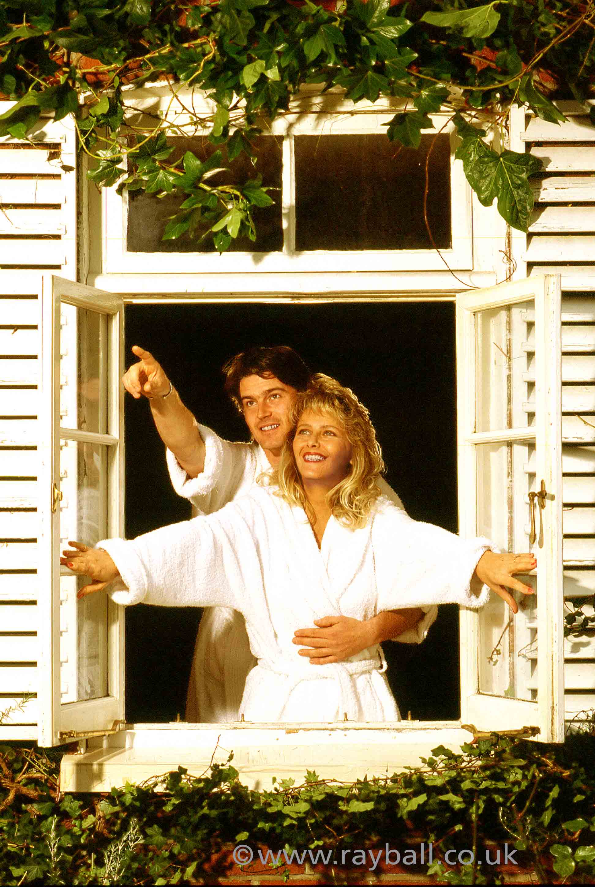 Ashstead couple in window by Epsom Photography Surrey.