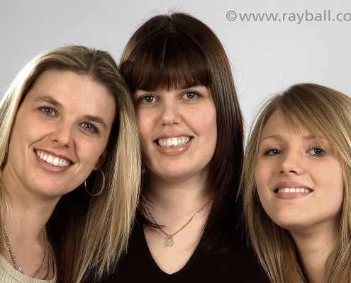 Portrait of three happy sisters from Headley