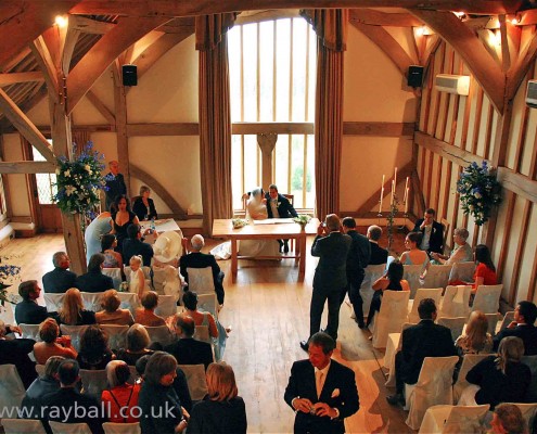 Kingswood wedding couple in opulent interior of converted barn.